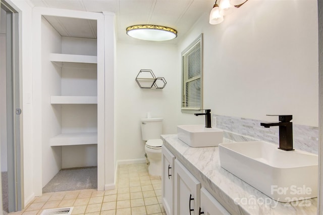 4648 Rifle Range Rd, Conover, NC 28613 - full bathroom with double vanity, tile patterned flooring, and toilet