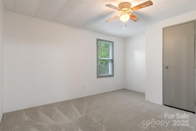 4648 Rifle Range Rd, Conover, NC 28613 - spare room featuring carpet floors and a ceiling fan