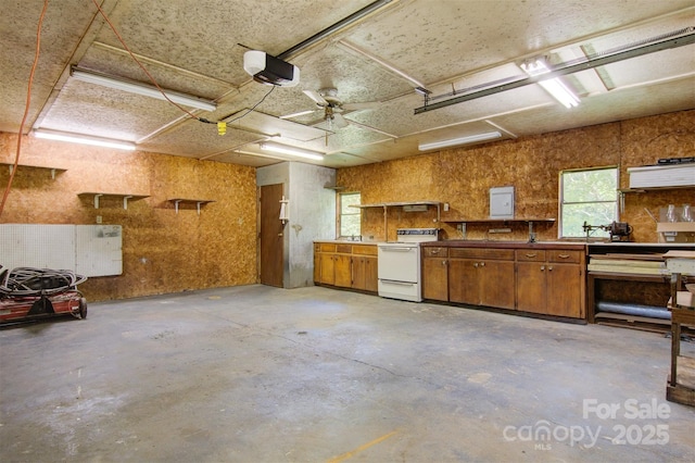 4648 Rifle Range Rd, Conover, NC 28613 - garage with a garage door opener, a workshop area, and a ceiling fan