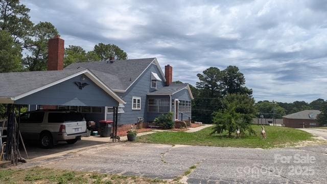 187 Cartledge Creek Rd, Rockingham, NC 28379 - view of front of property featuring a chimney and asphalt driveway