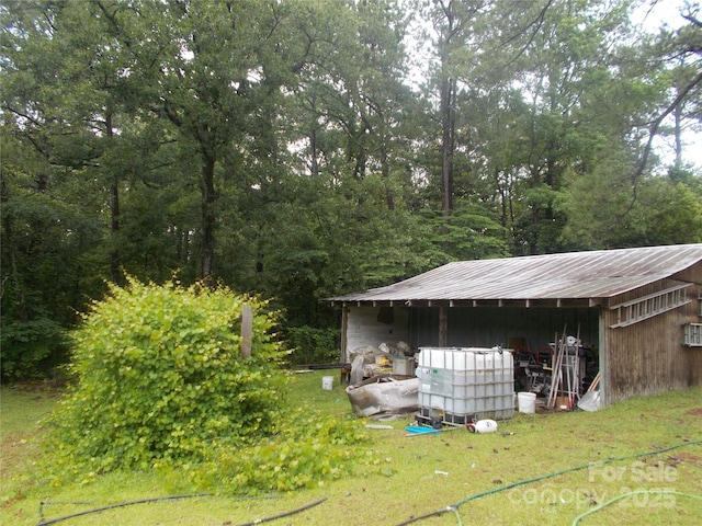 187 Cartledge Creek Rd, Rockingham, NC 28379 - view of pole building featuring a view of trees