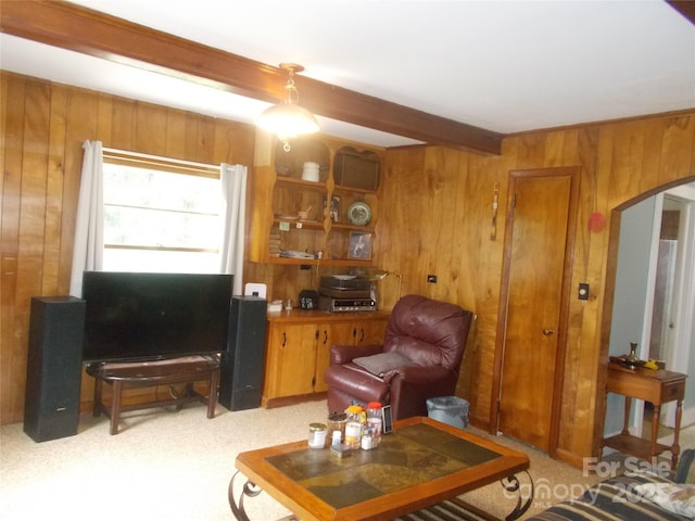 187 Cartledge Creek Rd, Rockingham, NC 28379 - living area with arched walkways, wooden walls, beam ceiling, and light colored carpet