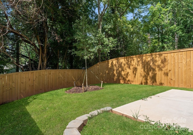 2004 St John St, Charlotte, NC 28216 - fenced backyard with a patio