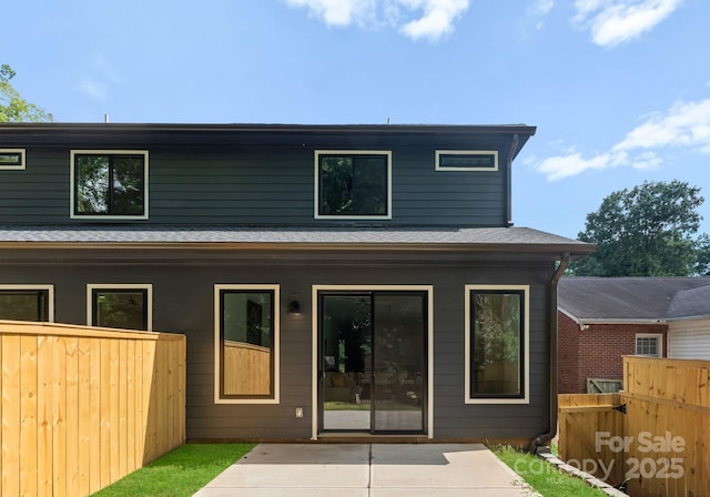 2004 St John St, Charlotte, NC 28216 - rear view of property featuring a patio and a shingled roof
