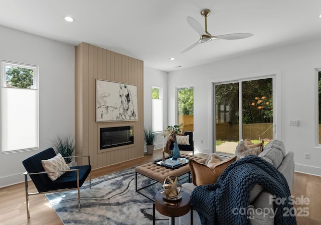 2004 St John St, Charlotte, NC 28216 - living area featuring light wood-style flooring, a large fireplace, recessed lighting, and a ceiling fan