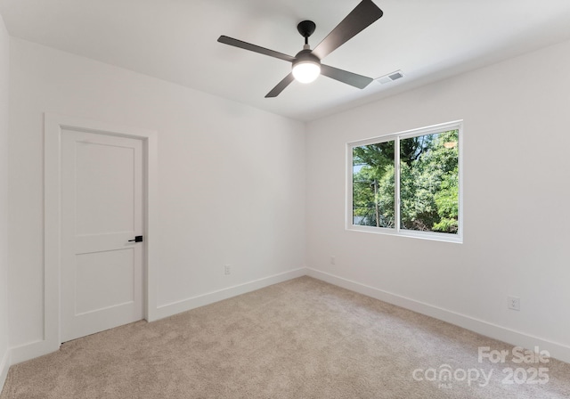 2004 St John St, Charlotte, NC 28216 - unfurnished room with light carpet and a ceiling fan