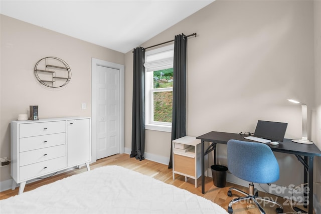 109 Thurland Ave, Asheville, NC 28803 - bedroom with lofted ceiling, light wood-type flooring, and an office area