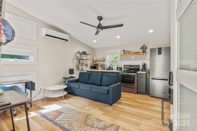 109 Thurland Ave, Asheville, NC 28803 - living room featuring an AC wall unit, ceiling fan, light wood-style floors, vaulted ceiling, and recessed lighting