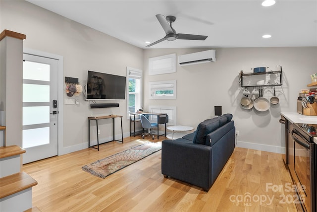 109 Thurland Ave, Asheville, NC 28803 - living room featuring an AC wall unit, a ceiling fan, light wood-style flooring, recessed lighting, and an office area
