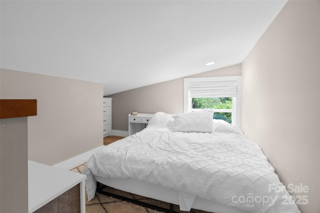 109 Thurland Ave, Asheville, NC 28803 - bedroom with vaulted ceiling, recessed lighting, and light wood finished floors