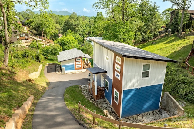 109 Thurland Ave, Asheville, NC 28803 - view of home's exterior featuring driveway, a yard, and board and batten siding