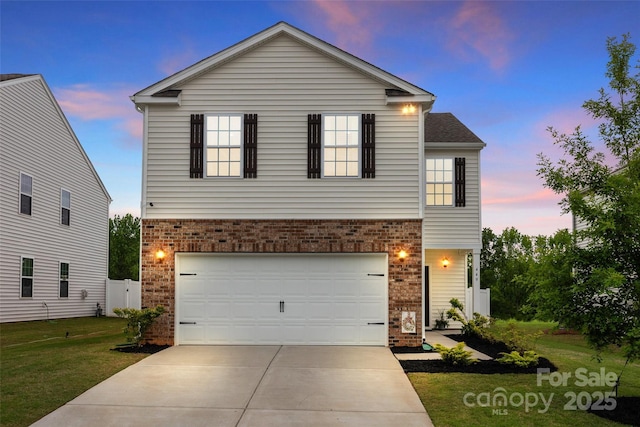 449 Misty Law Ln, Clover, SC 29710 - view of front of home featuring brick siding, a yard, driveway, and an attached garage