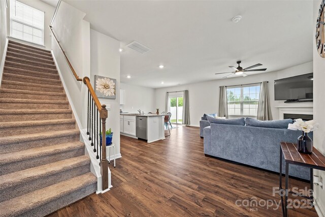 449 Misty Law Ln, Clover, SC 29710 - living room featuring stairs, ceiling fan, dark wood-style floors, recessed lighting, and a fireplace