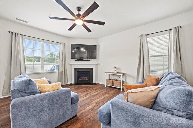 449 Misty Law Ln, Clover, SC 29710 - living area featuring ceiling fan, a fireplace with flush hearth, dark wood-style floors, and baseboards