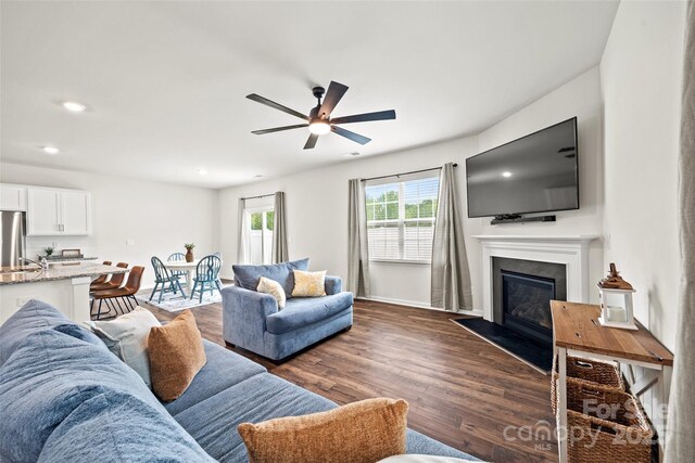 449 Misty Law Ln, Clover, SC 29710 - living area with a ceiling fan, dark wood-style floors, a fireplace with flush hearth, recessed lighting, and baseboards
