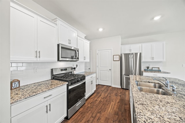 449 Misty Law Ln, Clover, SC 29710 - kitchen featuring appliances with stainless steel finishes, a sink, white cabinets, dark wood-style floors, and recessed lighting