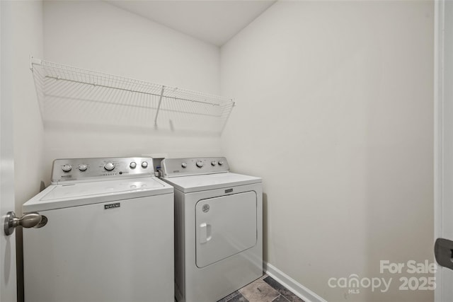 449 Misty Law Ln, Clover, SC 29710 - laundry area featuring washing machine and dryer and baseboards