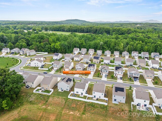 449 Misty Law Ln, Clover, SC 29710 - aerial perspective of suburban area featuring a mountainous background and a heavily wooded area