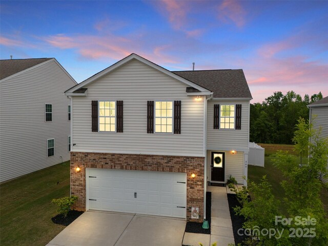 449 Misty Law Ln, Clover, SC 29710 - view of front of home with brick siding, driveway, an attached garage, and a front yard