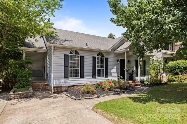 3801 Rosedown Dr, Matthews, NC 28105 - view of front of house featuring a front lawn, a shingled roof, and crawl space