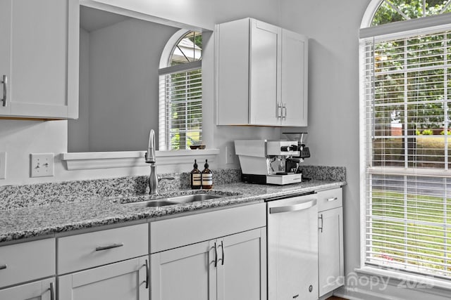3801 Rosedown Dr, Matthews, NC 28105 - kitchen featuring stainless steel dishwasher, a sink, white cabinets, and light stone countertops