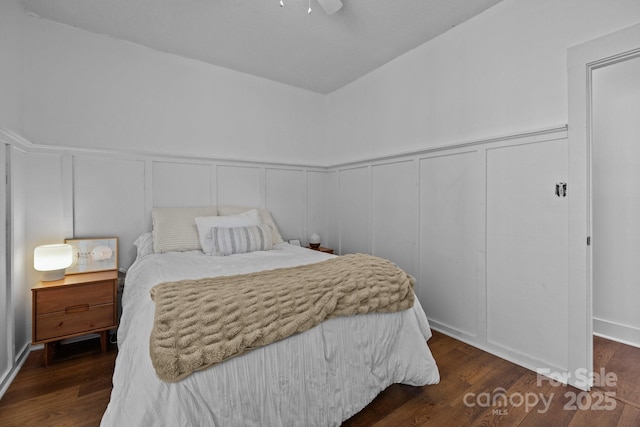 3801 Rosedown Dr, Matthews, NC 28105 - bedroom with a decorative wall, dark wood finished floors, a wainscoted wall, and ceiling fan