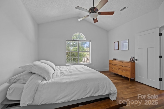 3801 Rosedown Dr, Matthews, NC 28105 - bedroom featuring wood finished floors, a textured ceiling, vaulted ceiling, and a ceiling fan