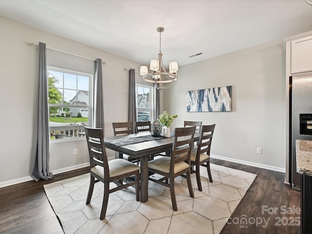 2017 New Hope Branch Way, Belmont, NC 28012 - dining space featuring a chandelier, wood finished floors, and baseboards