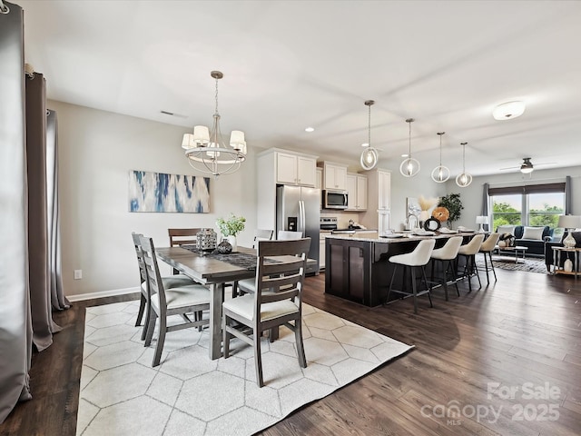 2017 New Hope Branch Way, Belmont, NC 28012 - dining space featuring a chandelier, dark wood-type flooring, baseboards, recessed lighting, and a ceiling fan