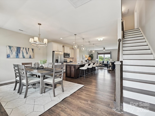 2017 New Hope Branch Way, Belmont, NC 28012 - dining space with a chandelier, wood finished floors, stairs, recessed lighting, and baseboards