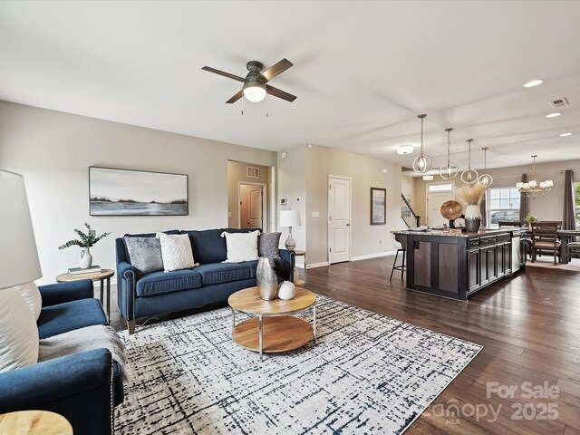 2017 New Hope Branch Way, Belmont, NC 28012 - living area with ceiling fan, dark wood-style floors, baseboards, recessed lighting, and a chandelier