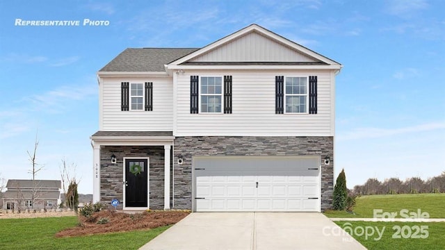 925 Two Brothers Ln, York, SC 29745 - view of front of house with stone siding, concrete driveway, an attached garage, and a front lawn