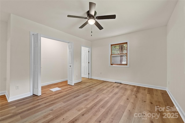 94 Camp Branch Rd, Black Mountain, NC 28711 - unfurnished bedroom with light wood-style flooring and a ceiling fan