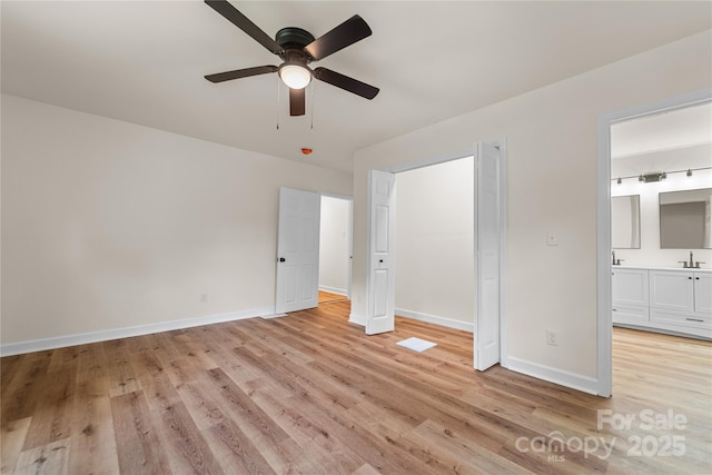 94 Camp Branch Rd, Black Mountain, NC 28711 - unfurnished bedroom with light wood-type flooring, ensuite bathroom, and ceiling fan