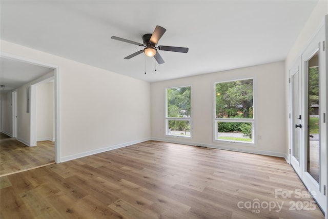 94 Camp Branch Rd, Black Mountain, NC 28711 - unfurnished room featuring plenty of natural light, light wood-type flooring, and a ceiling fan