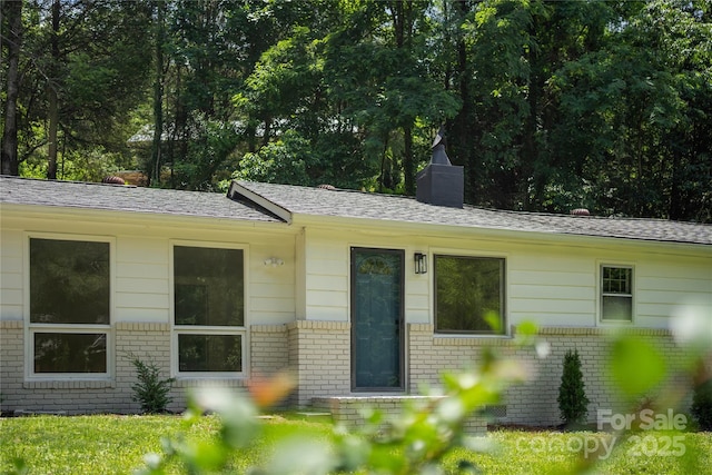 94 Camp Branch Rd, Black Mountain, NC 28711 - single story home featuring brick siding, a chimney, and a shingled roof