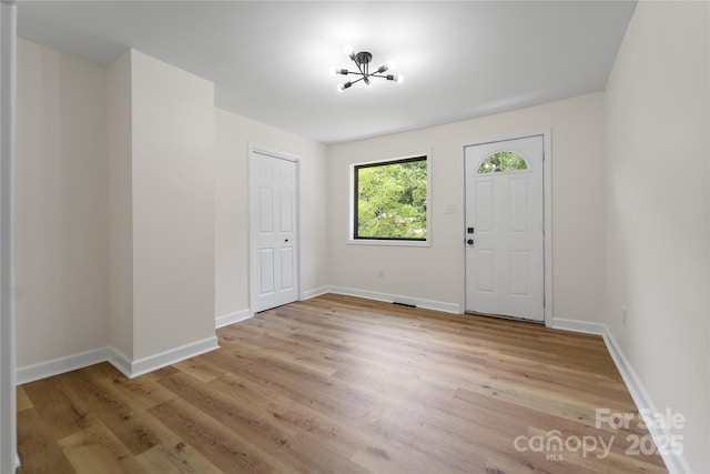 94 Camp Branch Rd, Black Mountain, NC 28711 - entrance foyer featuring light wood-style floors and a chandelier