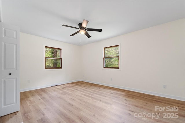 94 Camp Branch Rd, Black Mountain, NC 28711 - unfurnished room with plenty of natural light, light wood-type flooring, and a ceiling fan