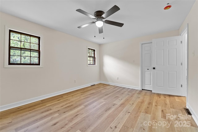 94 Camp Branch Rd, Black Mountain, NC 28711 - unfurnished bedroom featuring light wood-style flooring and a ceiling fan