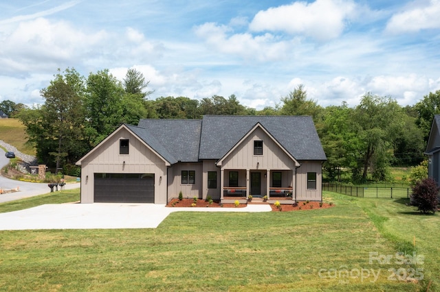 9 Robey Dr, Fletcher, NC 28732 - modern farmhouse style home featuring covered porch, driveway, a garage, board and batten siding, and a shingled roof