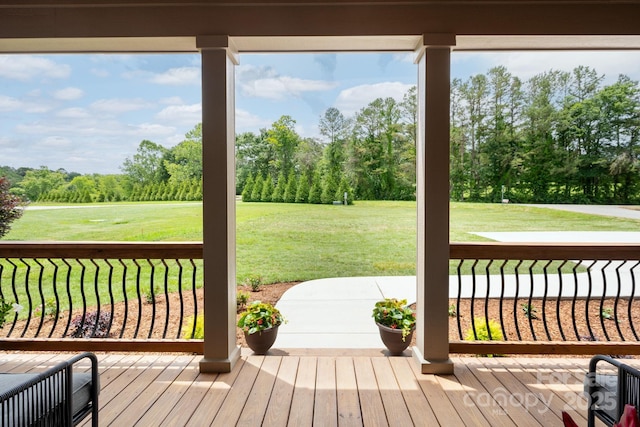 9 Robey Dr, Fletcher, NC 28732 - wooden porch with a lawn and view of wooded area