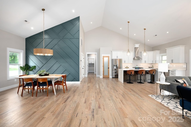 9 Robey Dr, Fletcher, NC 28732 - dining room featuring high vaulted ceiling and light wood-style floors
