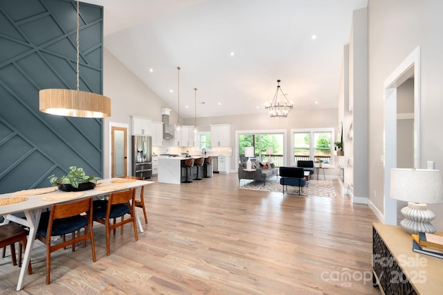 9 Robey Dr, Fletcher, NC 28732 - dining area with high vaulted ceiling, light wood-type flooring, a chandelier, and recessed lighting
