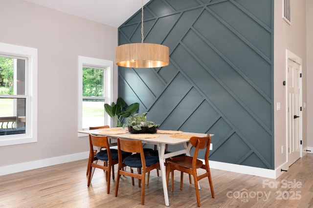 9 Robey Dr, Fletcher, NC 28732 - dining area with a decorative wall, plenty of natural light, and light wood finished floors