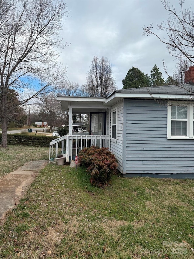 341 Talley St, Troutman, NC 28166 - view of home's exterior featuring a porch and a yard