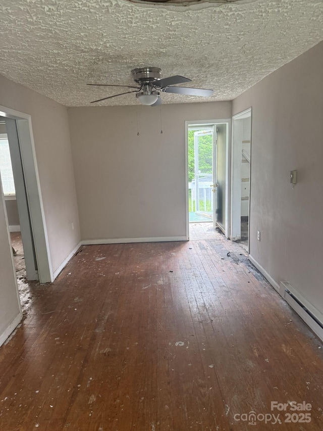 341 Talley St, Troutman, NC 28166 - unfurnished room with hardwood / wood-style flooring, a ceiling fan, and baseboards