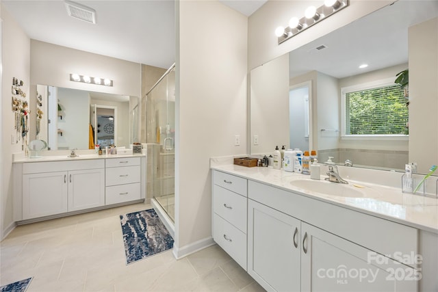 5088 Watersail Way, Clover, SC 29710 - bathroom featuring a shower stall, two vanities, tile patterned floors, and baseboards
