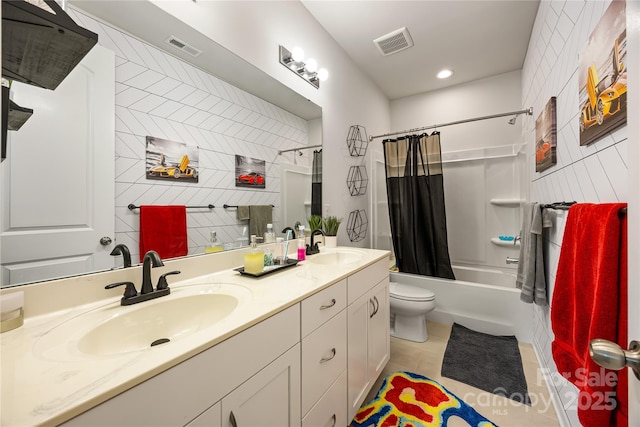 5088 Watersail Way, Clover, SC 29710 - bathroom featuring double vanity, toilet, shower / tub combo, tile patterned flooring, and tile walls