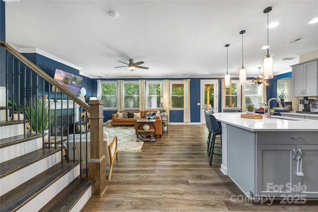 5088 Watersail Way, Clover, SC 29710 - kitchen with gray cabinetry, ornamental molding, a sink, open floor plan, and a ceiling fan