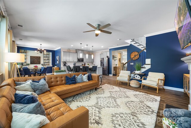5088 Watersail Way, Clover, SC 29710 - living area featuring stairway, ceiling fan, a chandelier, wood finished floors, and crown molding